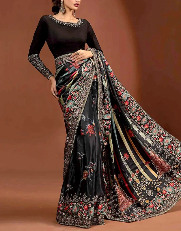 Black floral silk saree with raw silk body front view - Pakistani embroidered saree with zari nag work